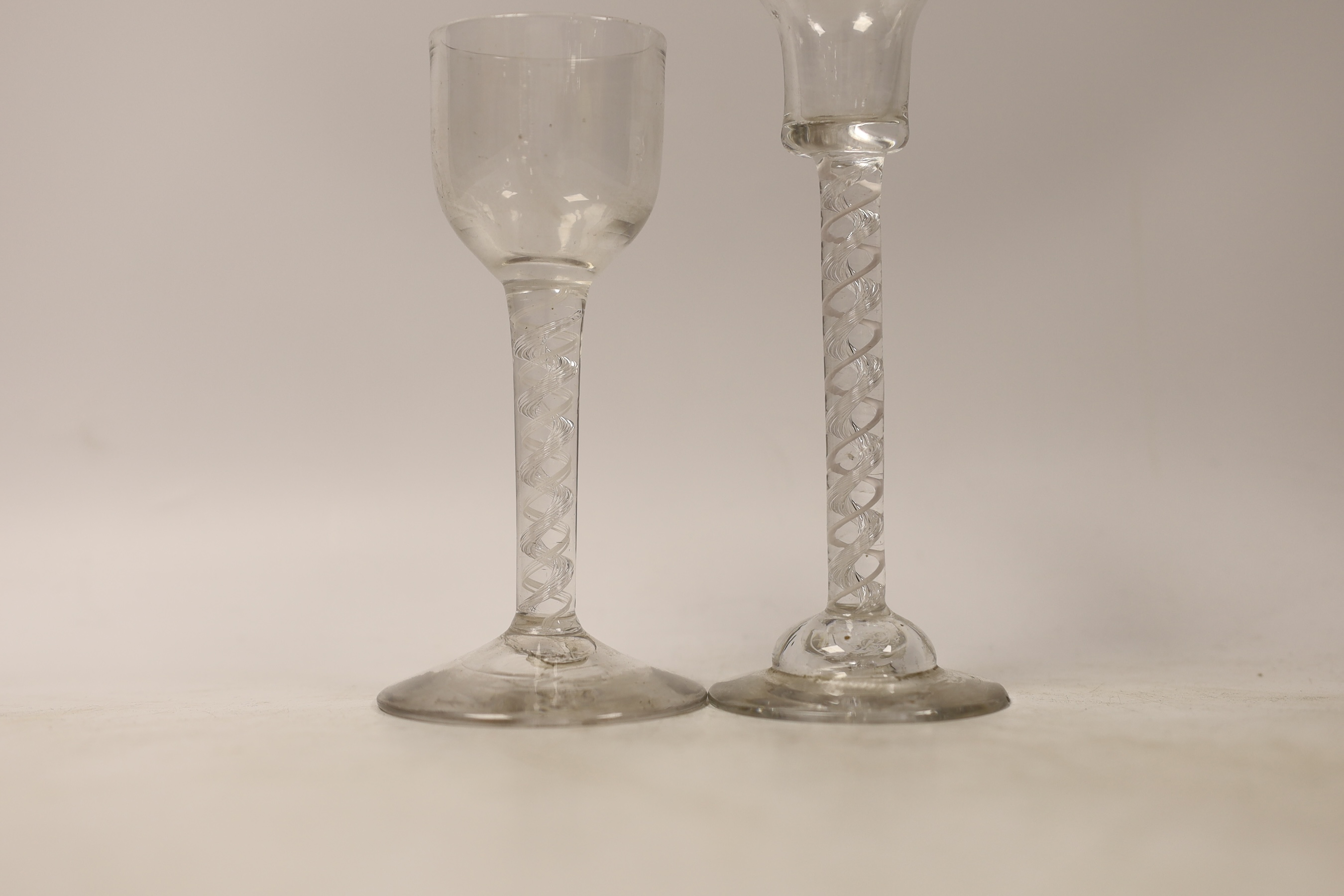 Two George II double series mixed twist cordial glasses, one with domed foot, tallest 16cm